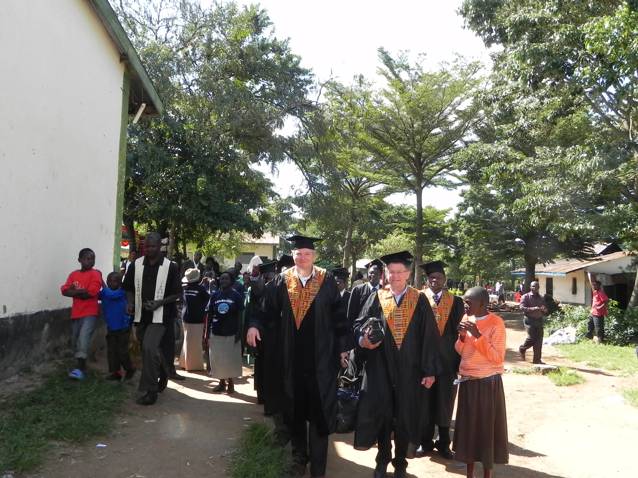 Graduates in front of the school building