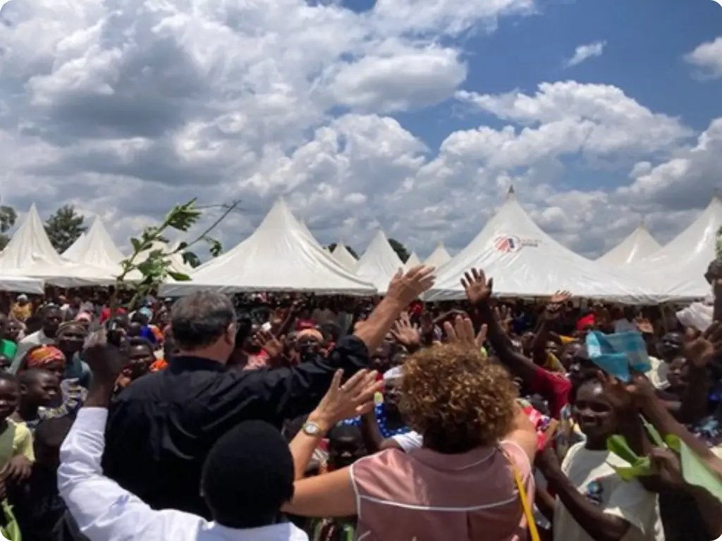 A large crowd under tents in Uganda