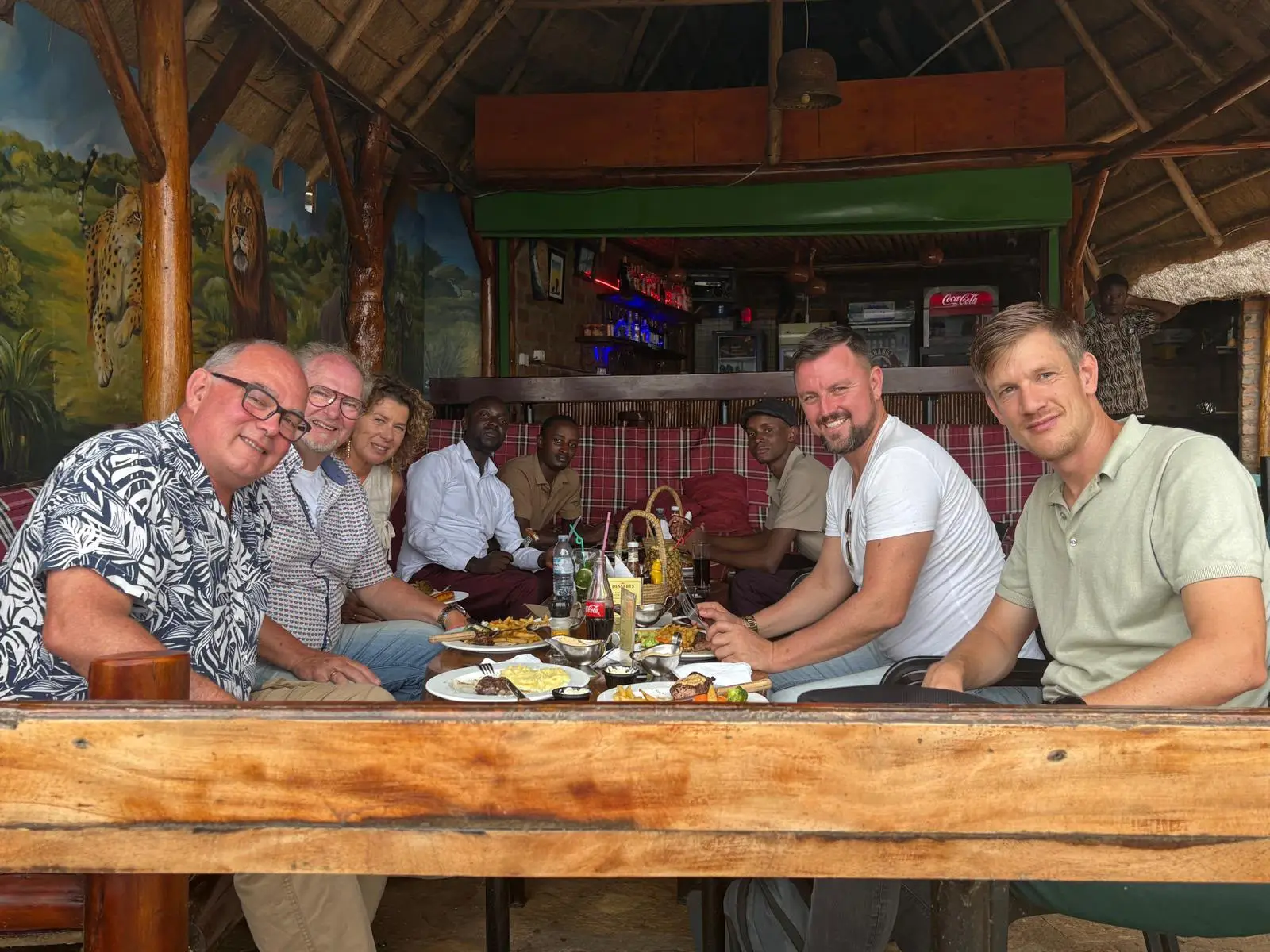 A group around a table in Uganda